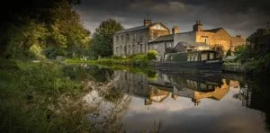 Reflection of a barge in Leeds and Liverpool canal at Dowley Gap near Bingley