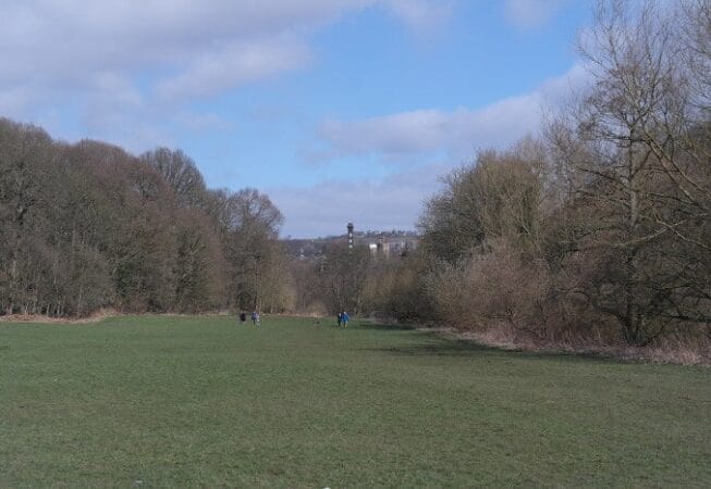 View of Damart chimney in the background from Myrtle Park on the River Aire bank