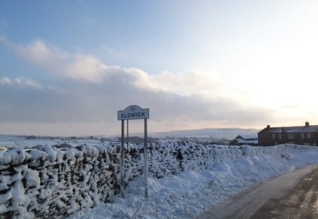 Snow covered sign of Eldwick