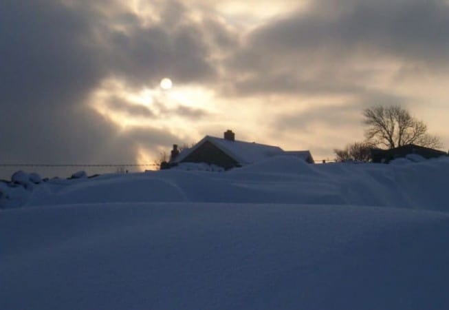 Snow Covered House in Eldwick with Sun Peeking through the Morning Clouds
