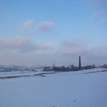 Rombalds Moors in Snow from Eldwick with Chimney in the Landscape