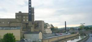 Canal view of the Damart Mill in Bingley - Photo by Cedric Farineau