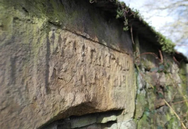 Old building in Beckfoot with Knights Templar markings above entrance