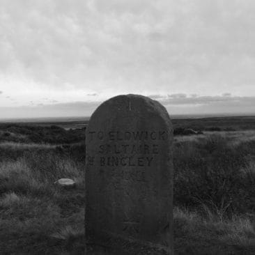 Stone Signpost on a path - Bingley Moor