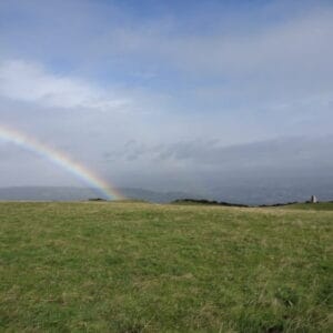 Rainbow on top of Norr Hill with trig point