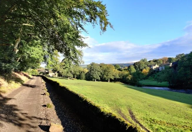 Track along River Aire leading towards Ravenroyd Riding Centre