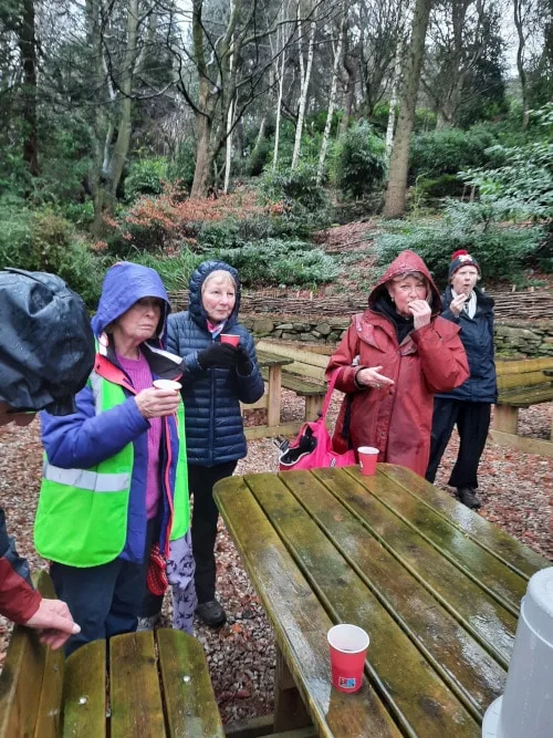 People sharing mince pies